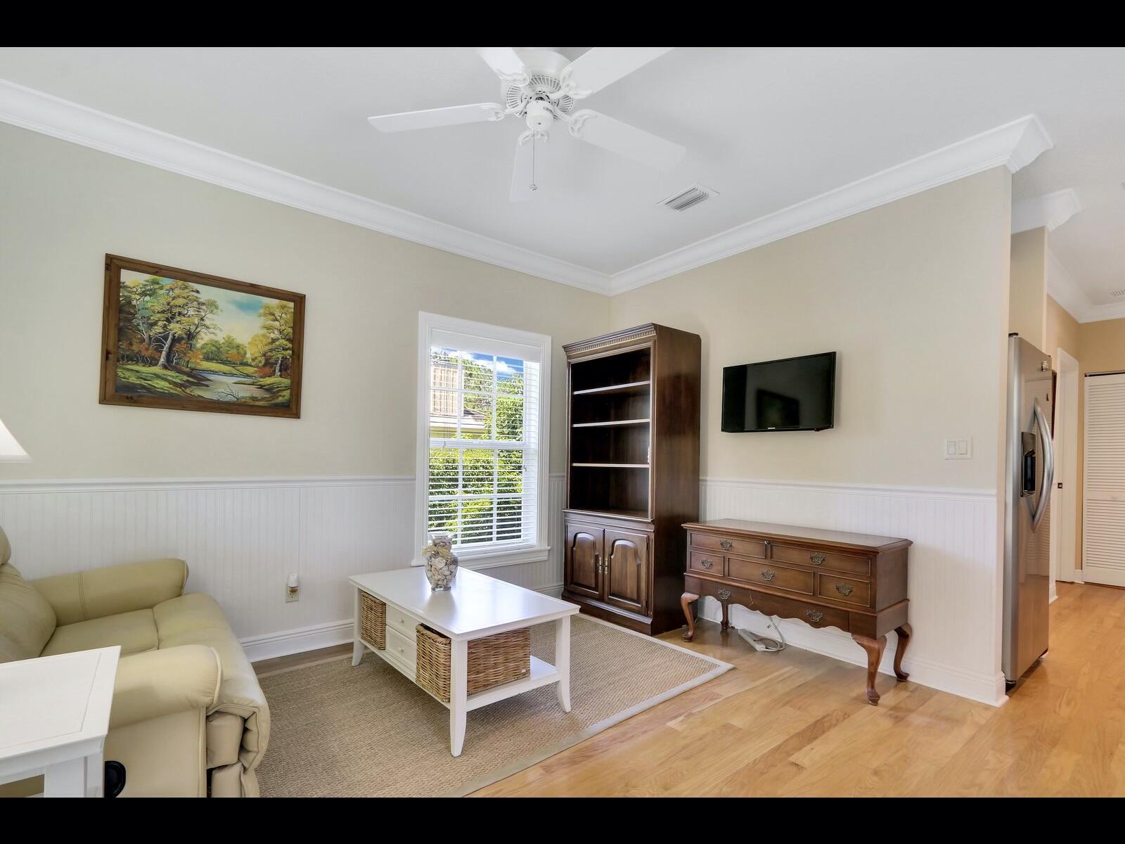 1856 Southeast Colony Way Jupiter, FL 33478 - Photo 7 of 10 a living room with furniture a rug and a window
