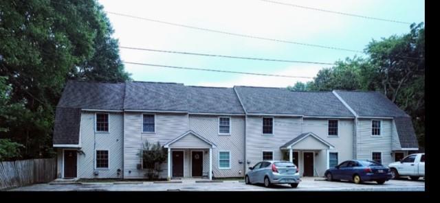 522 Jackson Street Rockmart, GA 30153 - Photo 13 of 27 a front view of a house with a garden and tree