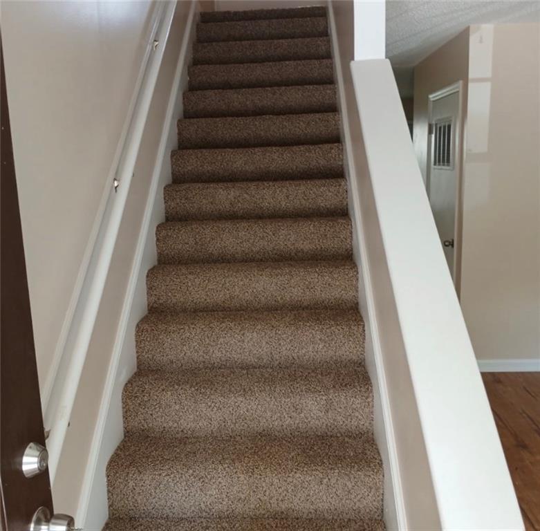 522 Jackson Street Rockmart, GA 30153 - Photo 26 of 27 a view of staircase with empty racks