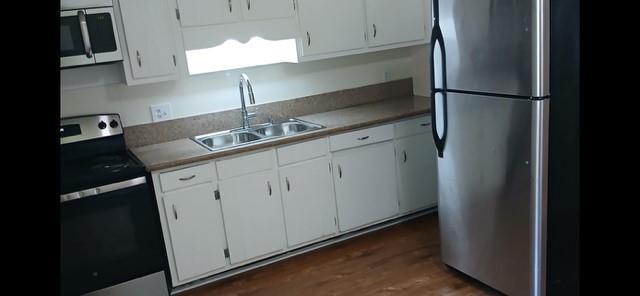 522 Jackson Street Rockmart, GA 30153 - Photo 5 of 27 a kitchen with a sink and cabinets