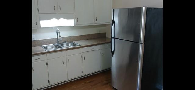 522 Jackson Street Rockmart, GA 30153 - Photo 6 of 27 a kitchen with appliances cabinets and a sink