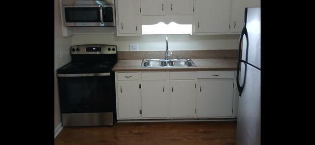 522 Jackson Street Rockmart, GA 30153 - Photo 7 of 27 a room with a sink and cabinets