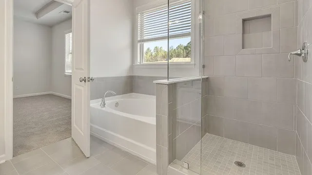 a bathroom with a sink toilet vanity and shower