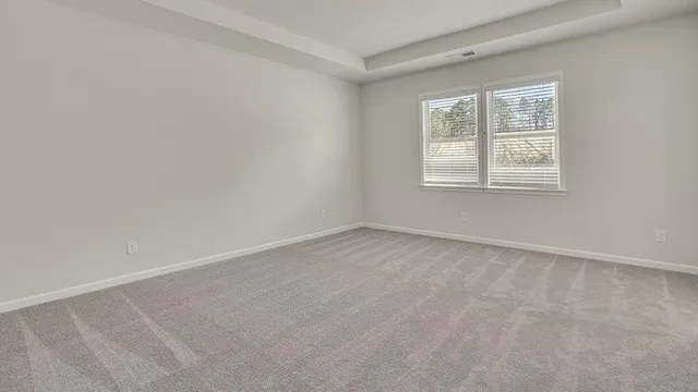 a bathroom with double sink and a mirror