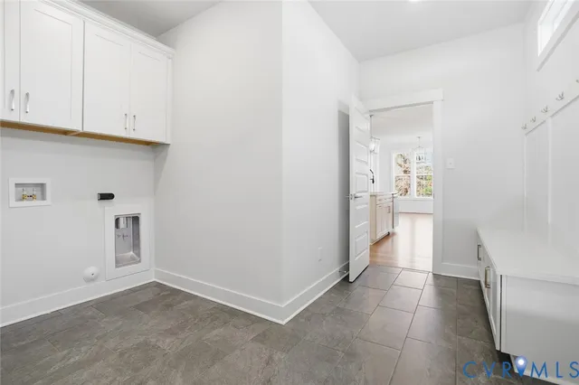 an aerial view of a house with garden space and street view