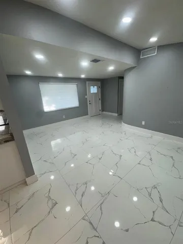 a kitchen with a stove a sink and a refrigerator