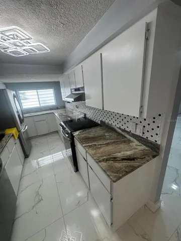 a view of a yard with an outdoor seating