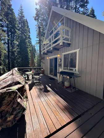 a view of a roof deck with wooden floor and seating space