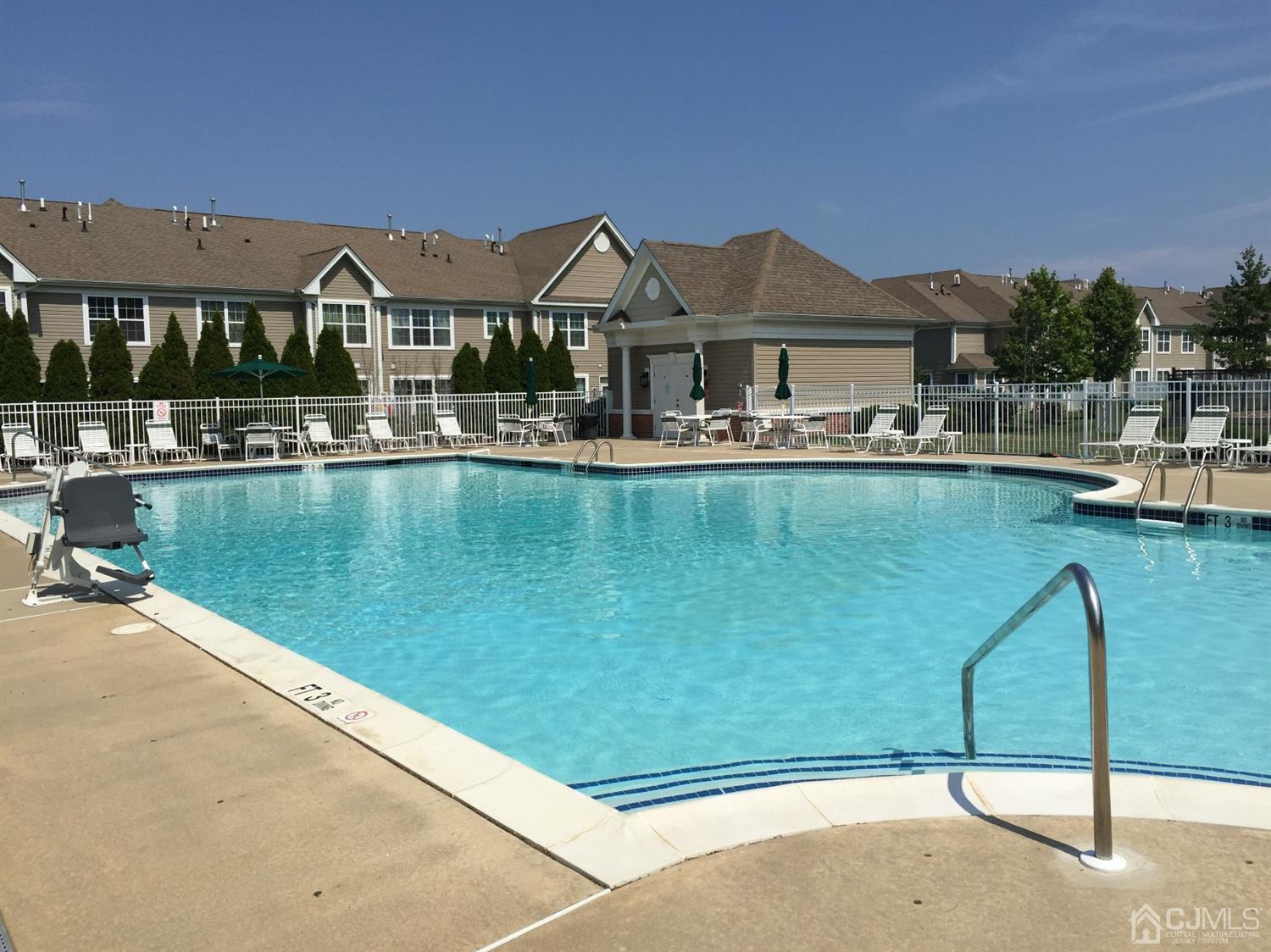 2332 Edward Stec Boulevard Edison, NJ 08837 - Photo 16 of 19 a front view of a house with swimming pool next to a yard