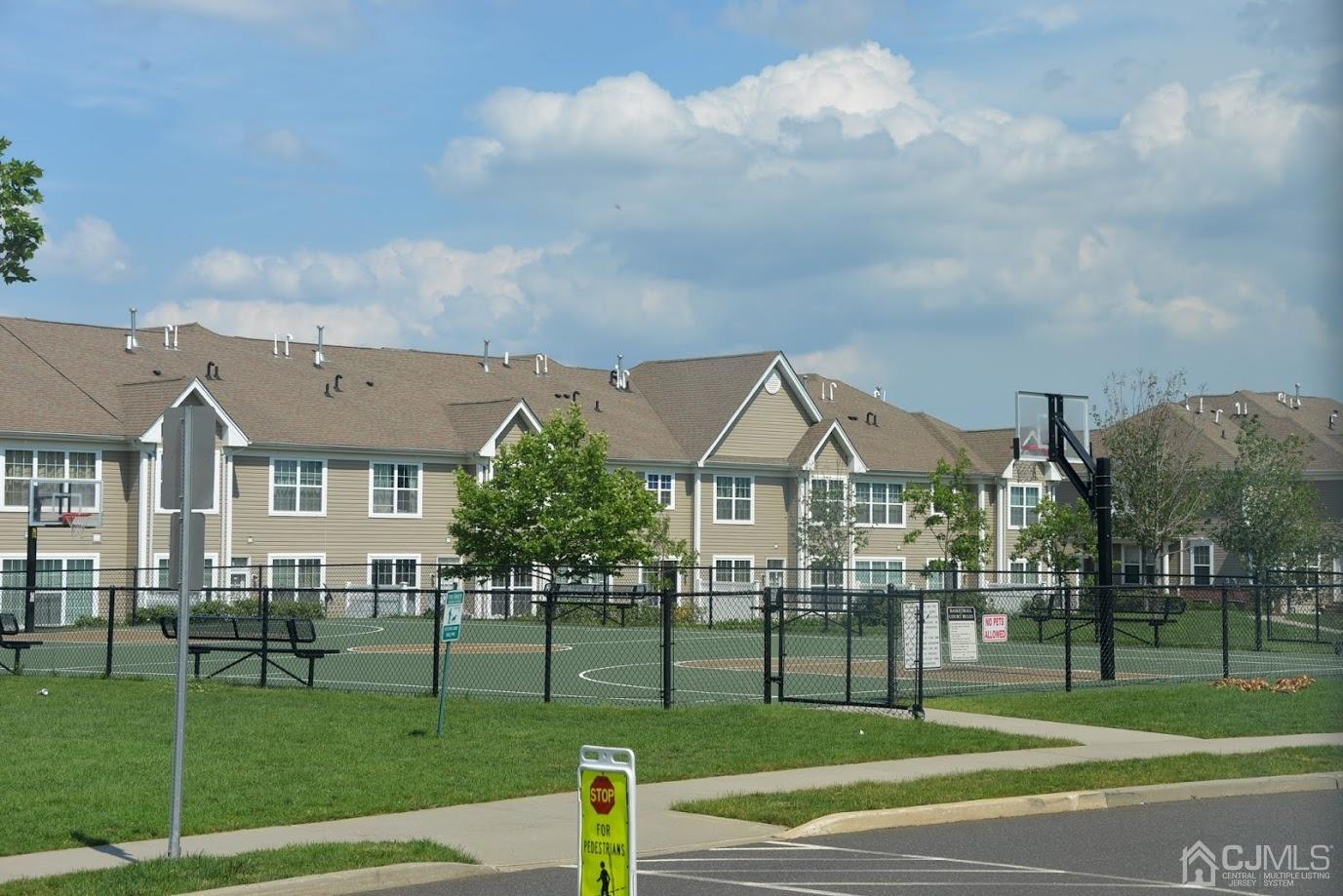 2332 Edward Stec Boulevard Edison, NJ 08837 - Photo 17 of 19 a front view of multiple houses with a yard