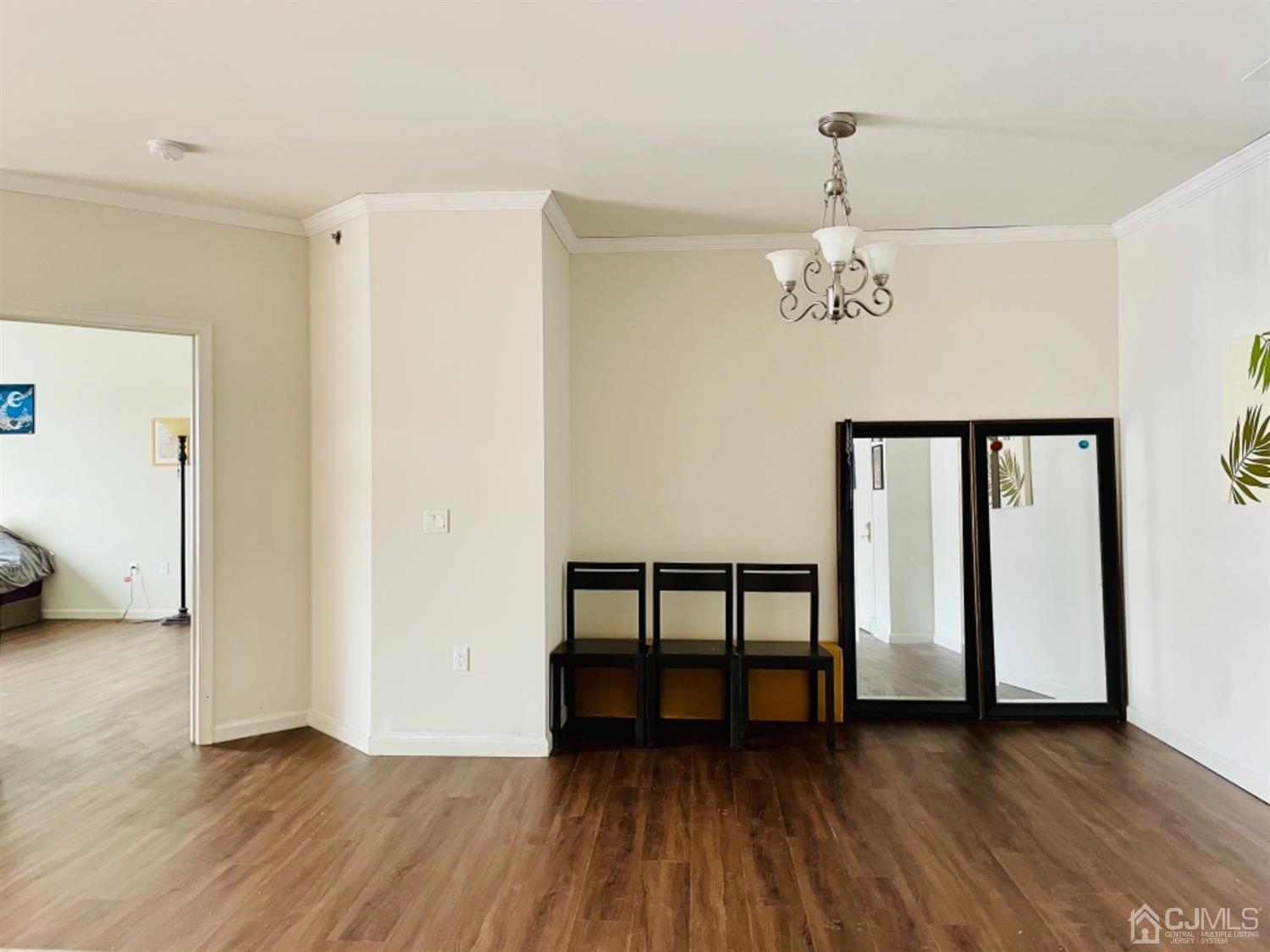 2332 Edward Stec Boulevard Edison, NJ 08837 - Photo 4 of 19 wooden floor in an empty room with a window