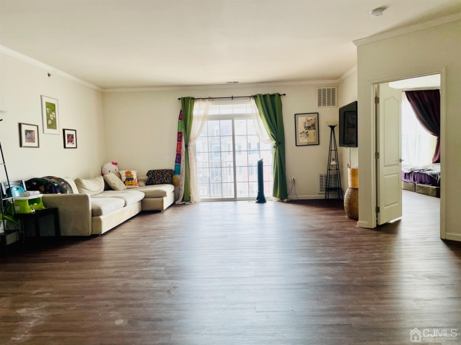 2332 Edward Stec Boulevard Edison, NJ 08837 - Photo 5 of 19 a living room with furniture and a wooden floor