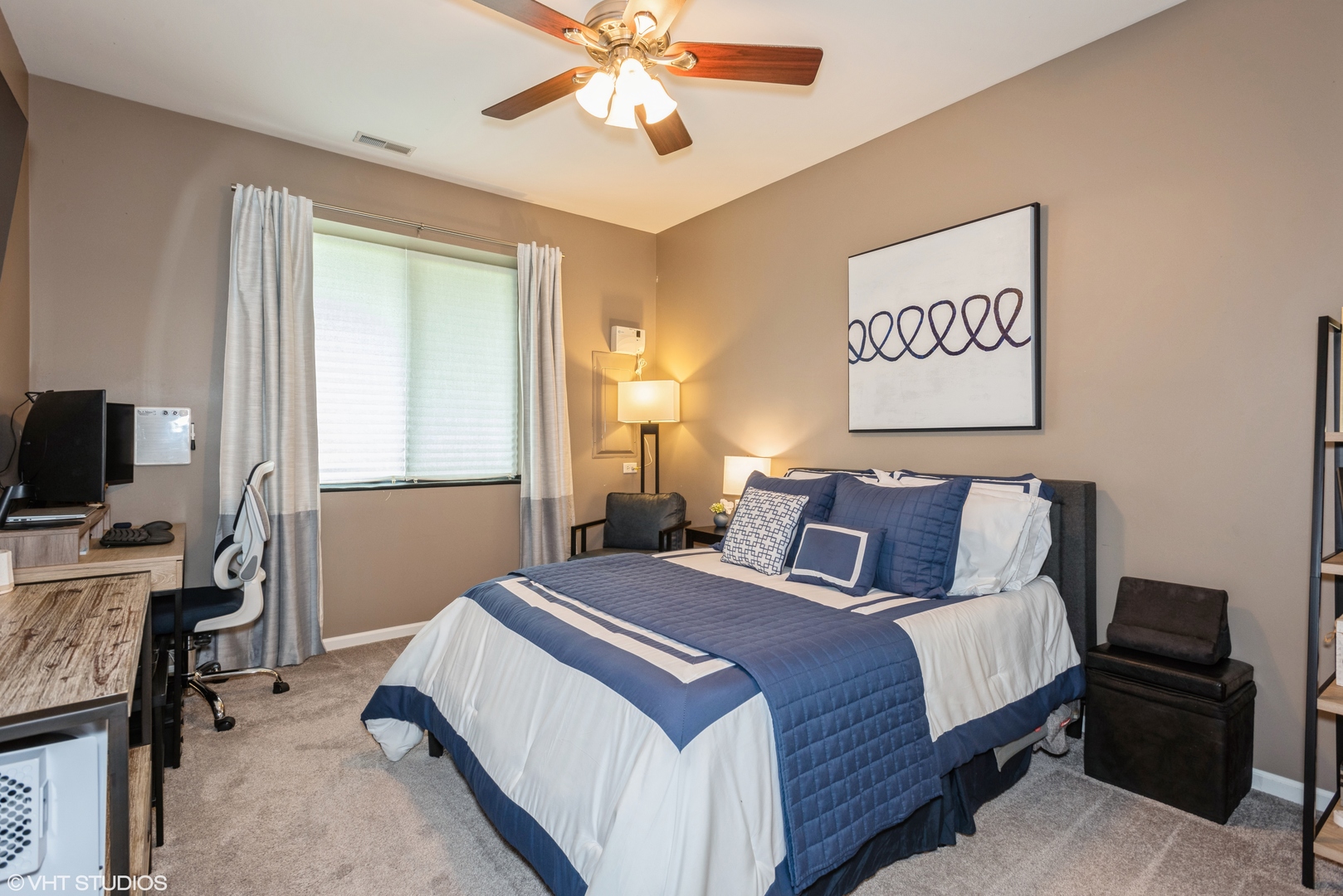 939 Oak Ridge Boulevard Elgin, IL 60120 - Photo 16 of 24 a bedroom with a bed and a flat screen tv
