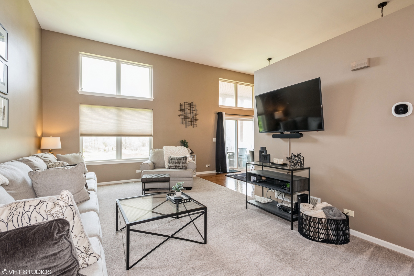 939 Oak Ridge Boulevard Elgin, IL 60120 - Photo 2 of 24 a living room with furniture and a flat screen tv
