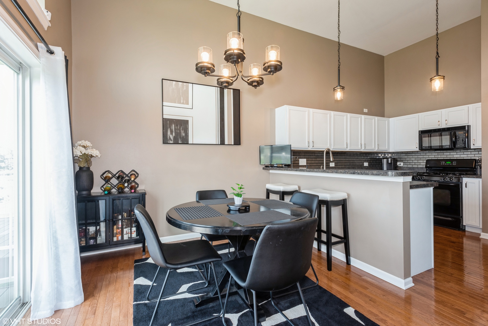 939 Oak Ridge Boulevard Elgin, IL 60120 - Photo 5 of 24 a view of a dining room with furniture and wooden floor