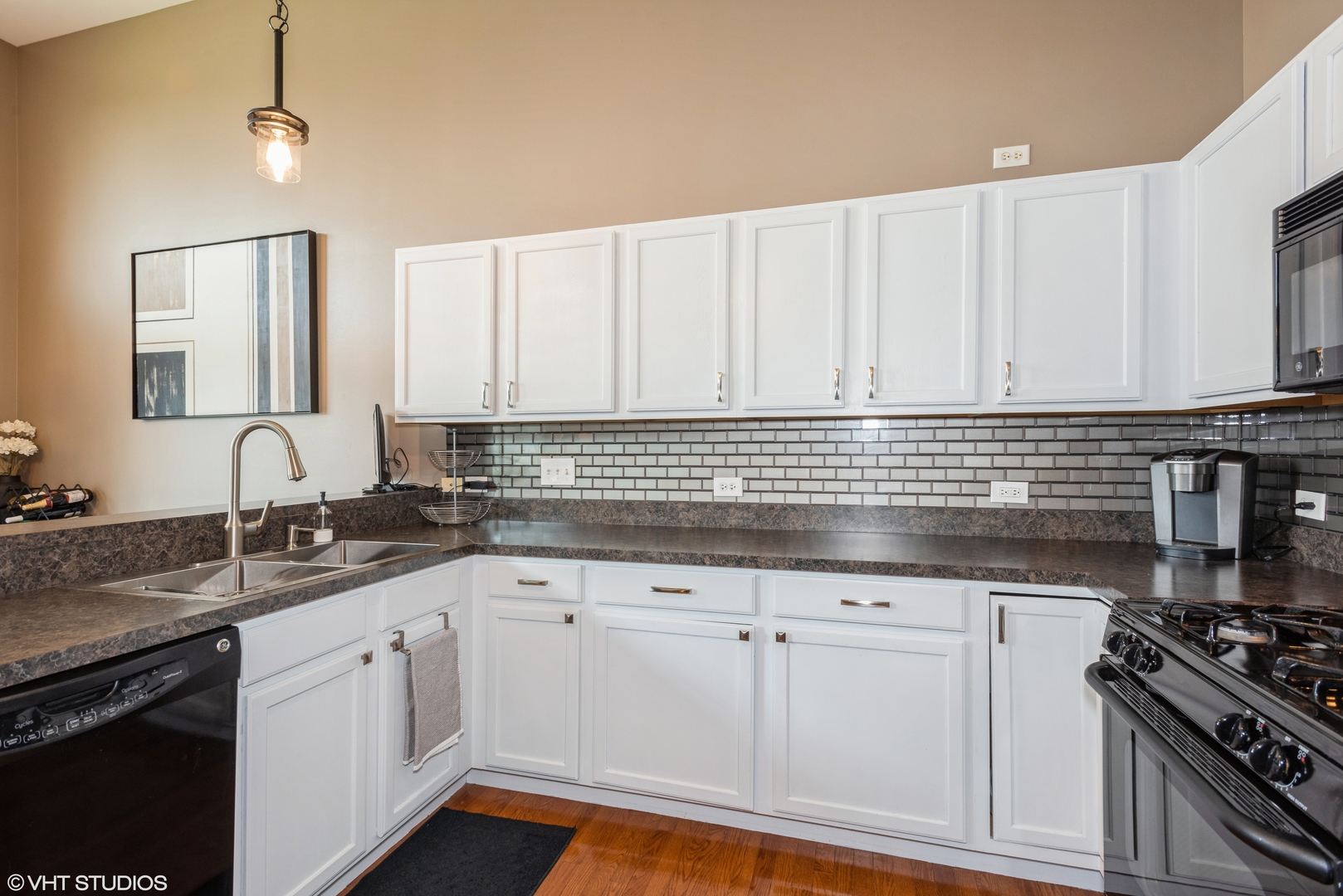 939 Oak Ridge Boulevard Elgin, IL 60120 - Photo 7 of 24 a kitchen with granite countertop a sink a stove and cabinets