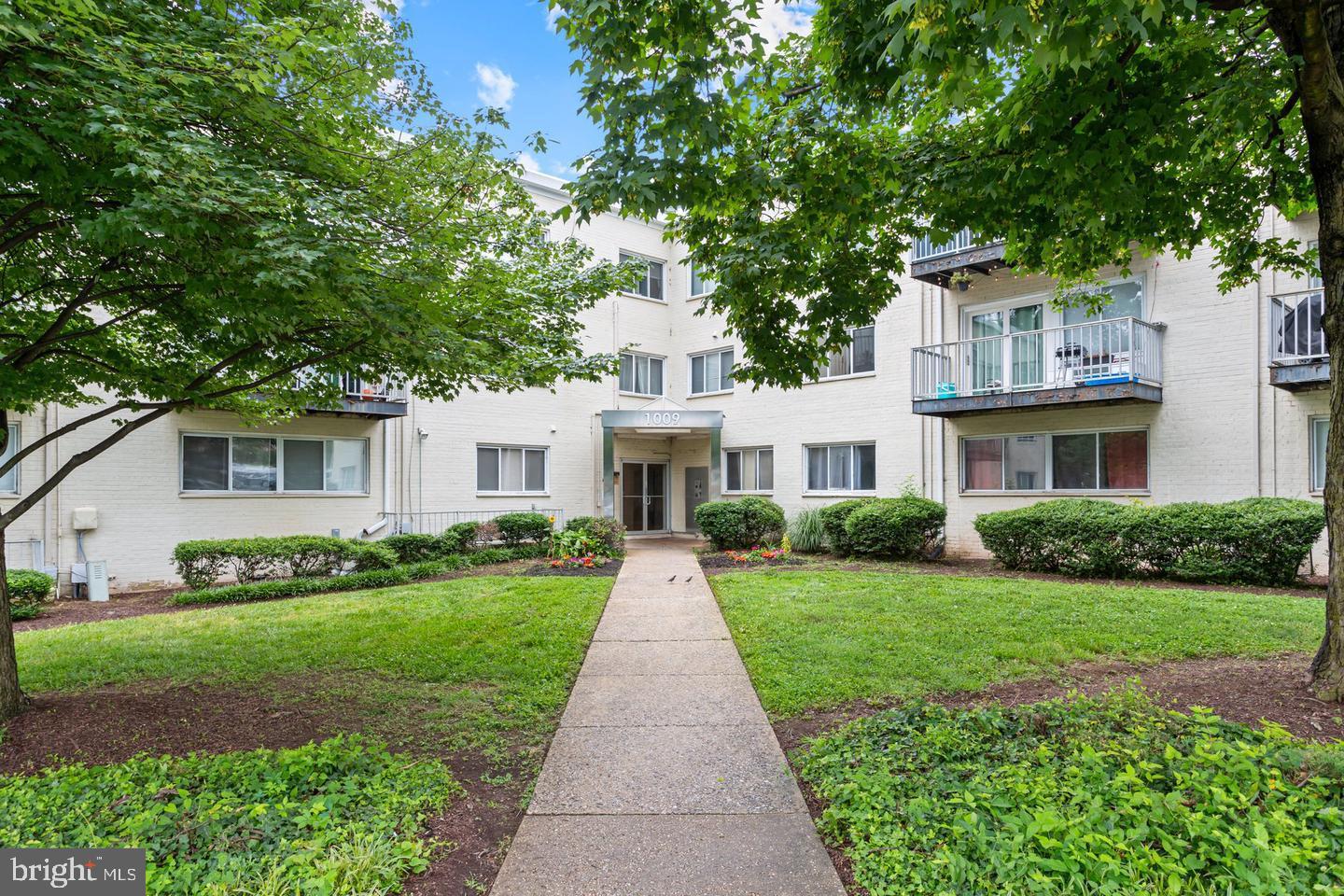 1009 Chillum Road, Unit 206 Hyattsville, MD 20782 - Photo 1 of 25 a front view of a house with a yard
