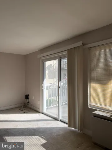 a view of balcony with wooden floor and fence