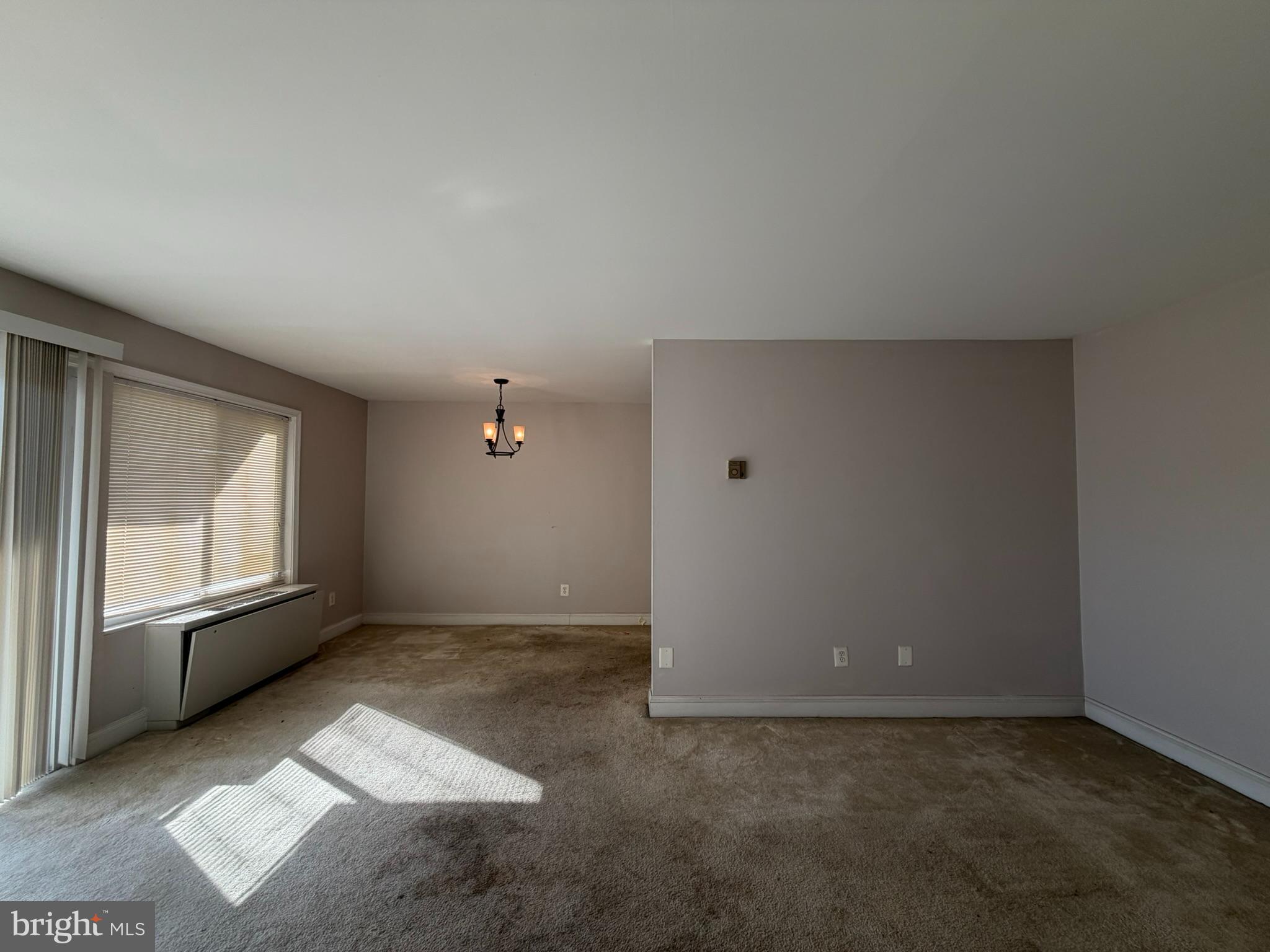 1009 Chillum Road, Unit 206 Hyattsville, MD 20782 - Photo 7 of 25 an empty room with windows