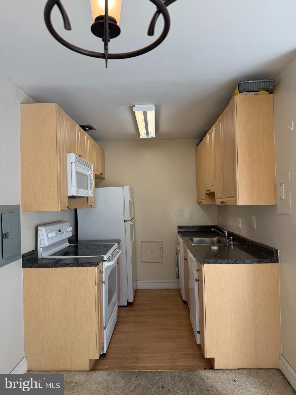 1009 Chillum Road, Unit 206 Hyattsville, MD 20782 - Photo 9 of 25 a kitchen with stainless steel appliances granite countertop a sink a stove and a microwave