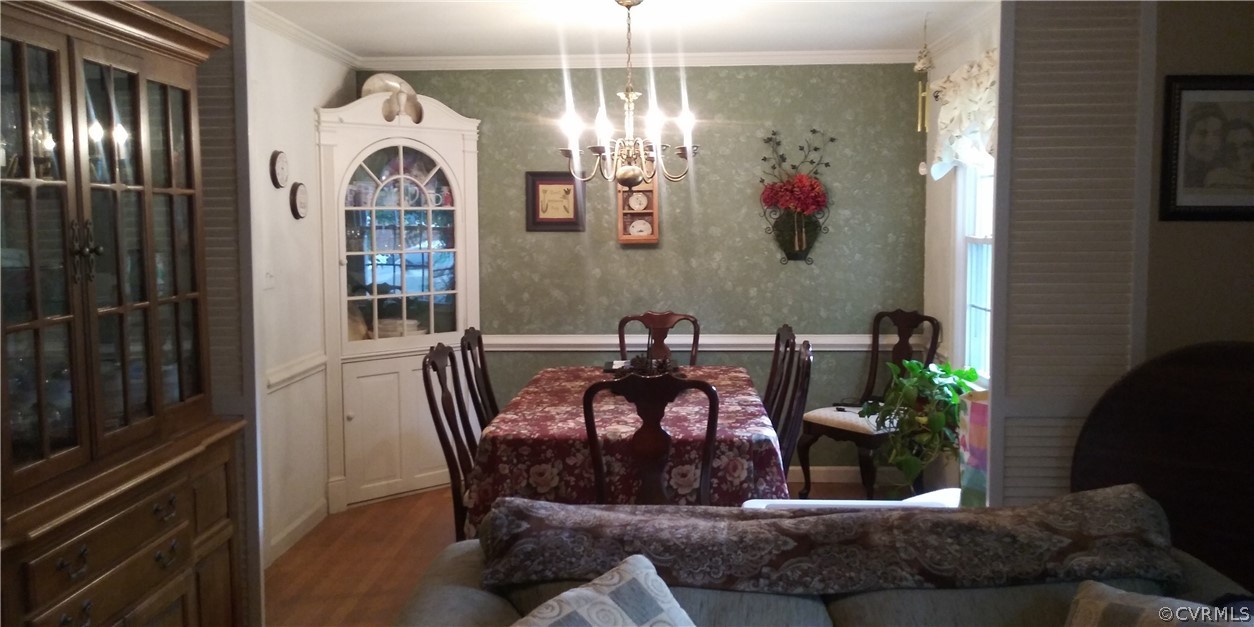 1308 Covington Road Colonial Heights, VA 23834 - Photo 4 of 15 a view of a dining room with furniture and chandelier
