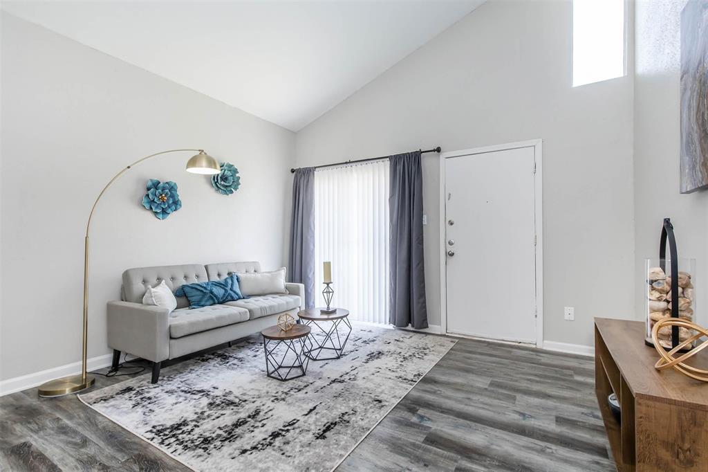 18001 Cypress Trace Road, Unit 2206 Houston, TX 77090 - Photo 1 of 17 a living room with furniture and wooden floor