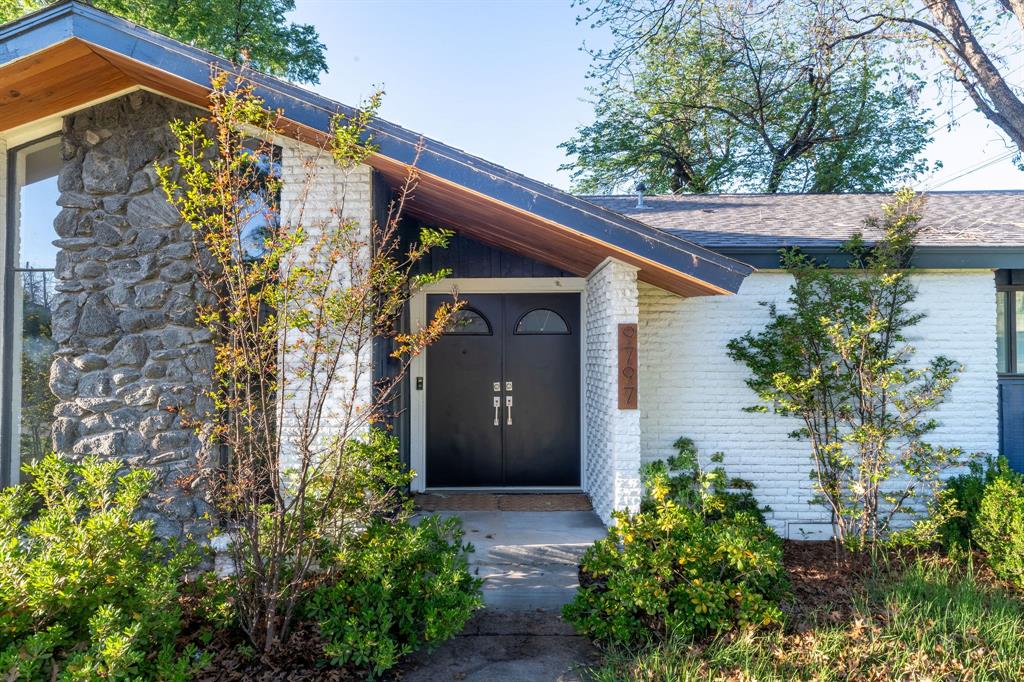 9797 Broken Bow Road Dallas, TX 75238 - Photo 2 of 16 a front view of a house with garden
