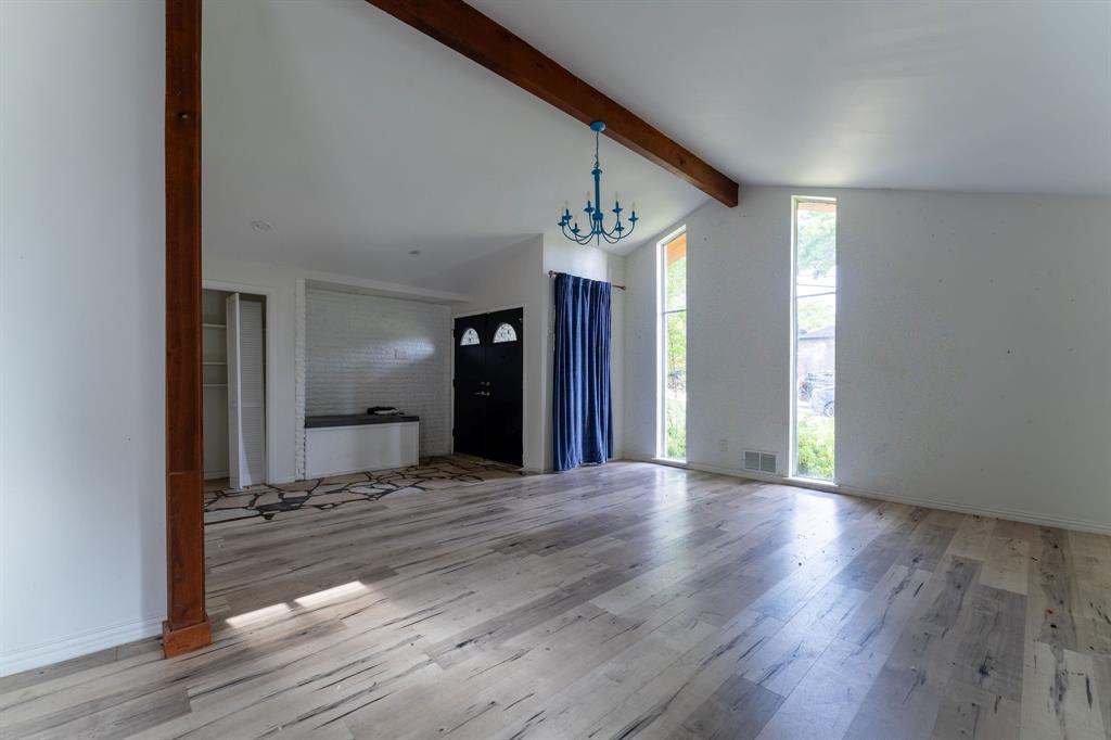 9797 Broken Bow Road Dallas, TX 75238 - Photo 4 of 16 a view of a hallway with wooden floor