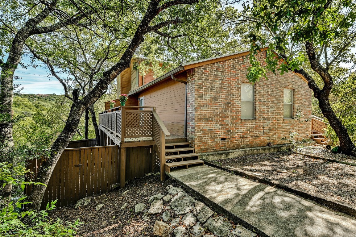 1709 Wild Basin Ledge, Unit B Austin, TX 78746 - Photo 1 of 1 a backyard of a house with lots of green space