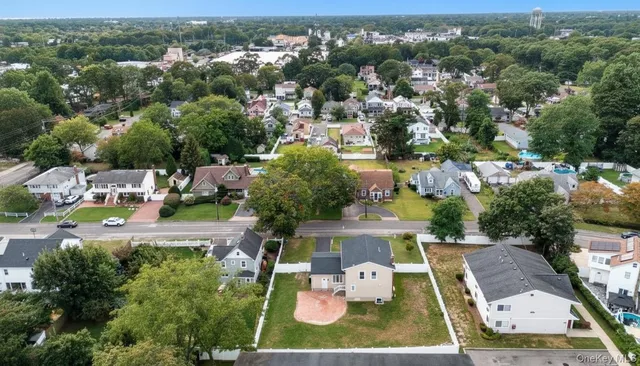 an aerial view of a house with a garden