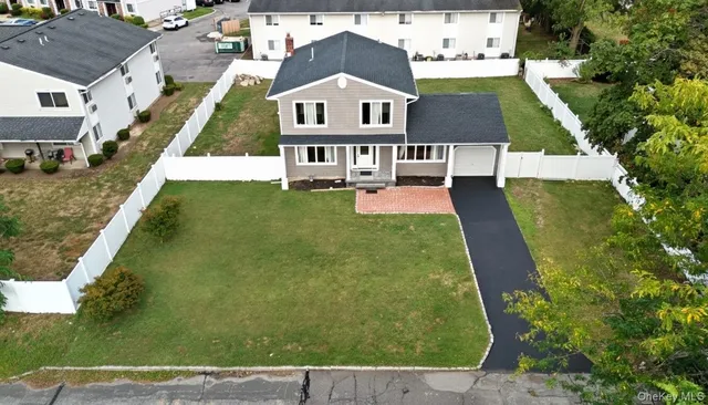 an aerial view of a house with swimming pool