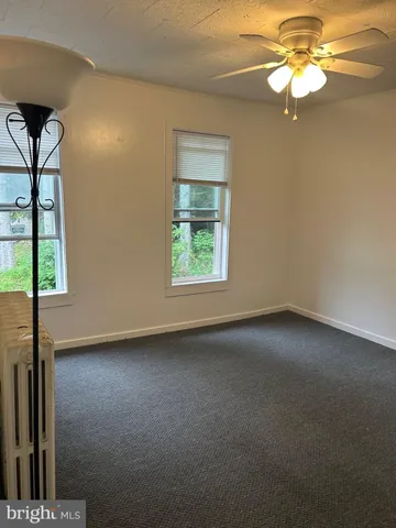 a bedroom with a bed and dresser