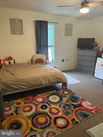 a view of a wooden deck and a yard