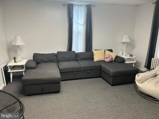 a living room with furniture and a couch