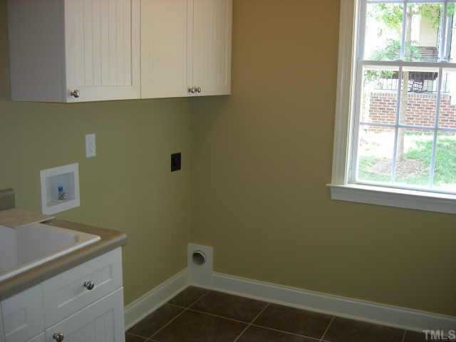 11519 Azari Court Raleigh, NC 27614 - Photo 8 of 10 a bathroom with a sink and cabinets
