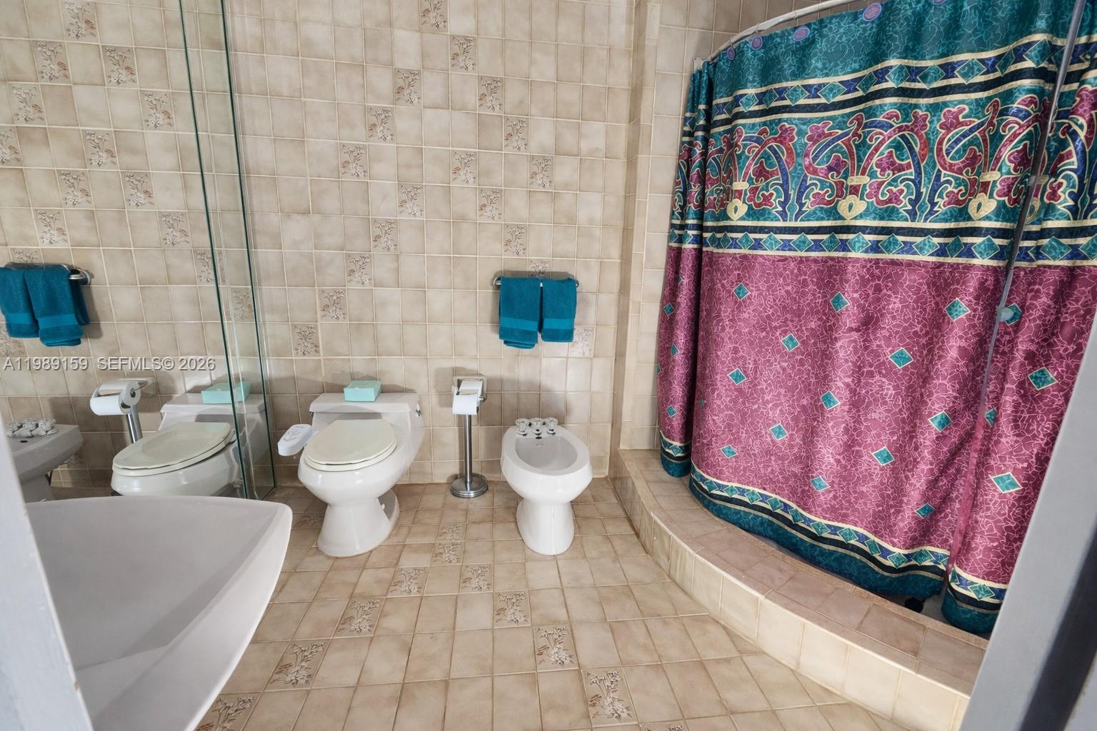 7344 Southwest 135th Court Miami, FL 33183 - Photo 12 of 24 a bathroom with a toilet sink and mirror