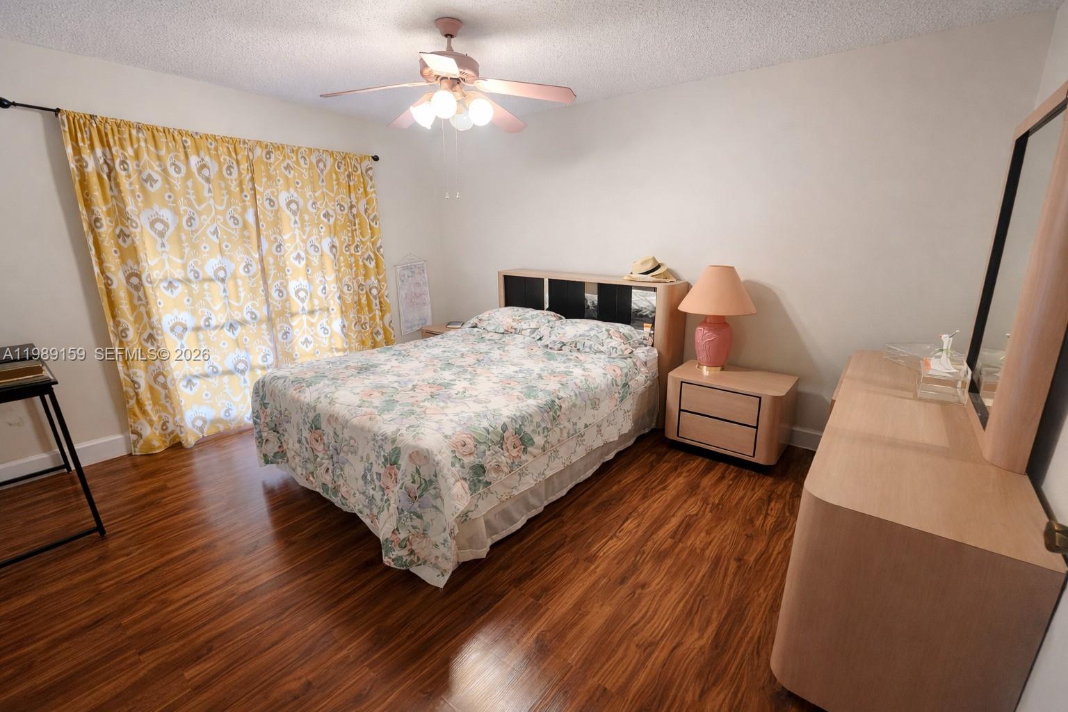 7344 Southwest 135th Court Miami, FL 33183 - Photo 13 of 24 a bedroom with a bed and wooden floor