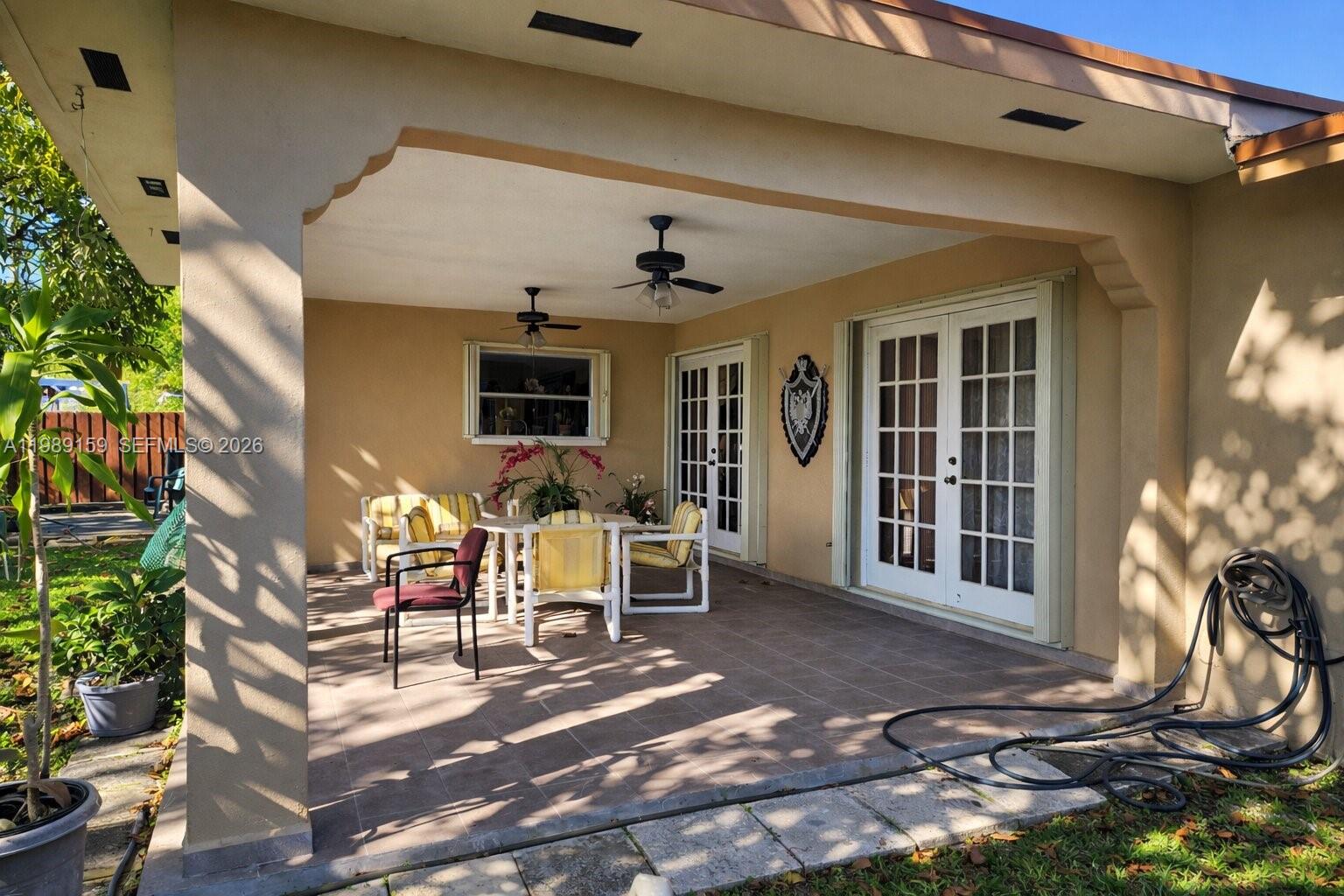 7344 Southwest 135th Court Miami, FL 33183 - Photo 16 of 24 a front view of a house with outdoor seating