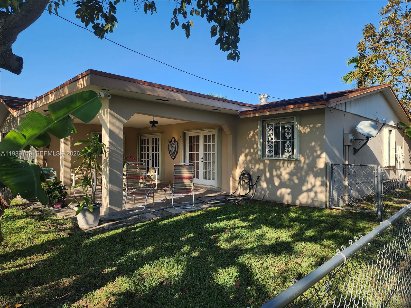 7344 Southwest 135th Court Miami, FL 33183 - Photo 17 of 24 a view of a house with backyard and porch