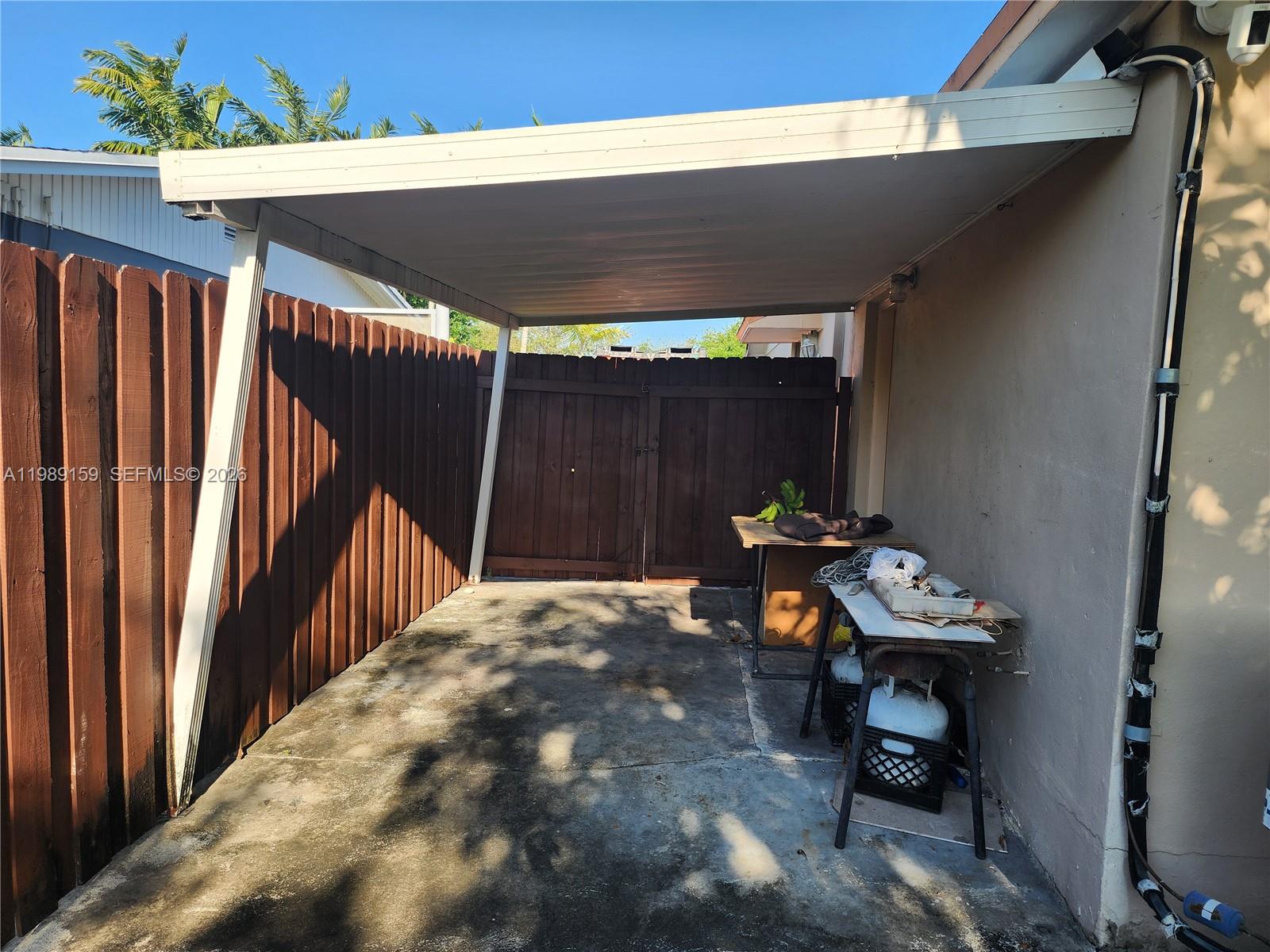 7344 Southwest 135th Court Miami, FL 33183 - Photo 18 of 24 a backyard of a house with table and chairs