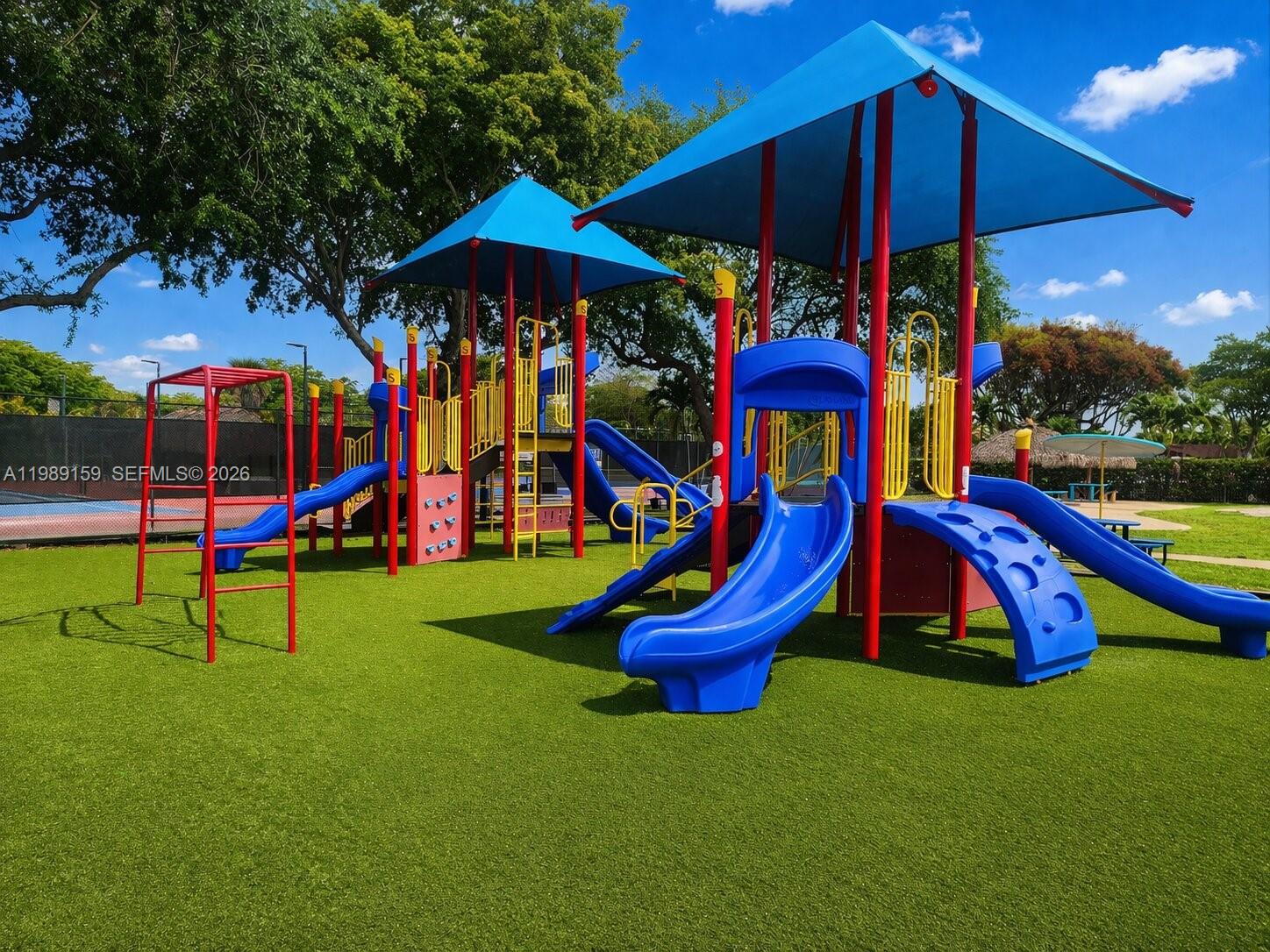 7344 Southwest 135th Court Miami, FL 33183 - Photo 22 of 24 a view of a park with slide and a bench