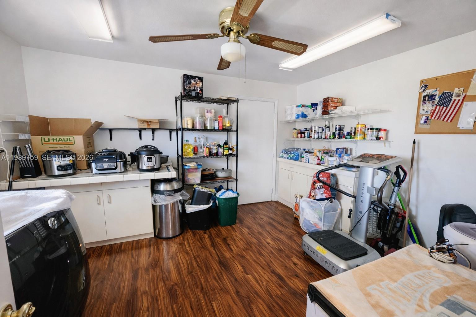 7344 Southwest 135th Court Miami, FL 33183 - Photo 5 of 24 a view of a workspace with furniture and a kitchen