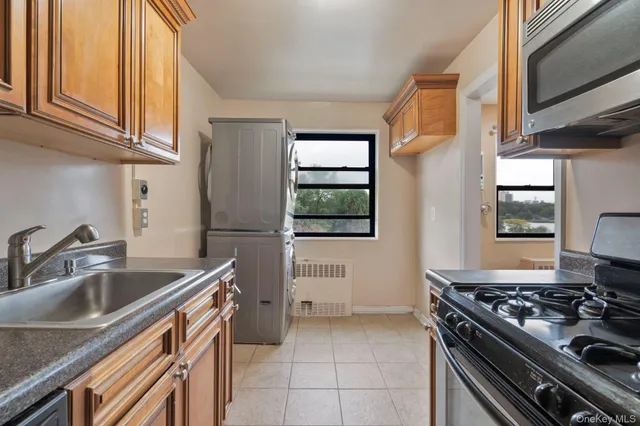 a kitchen that has a sink and a stove
