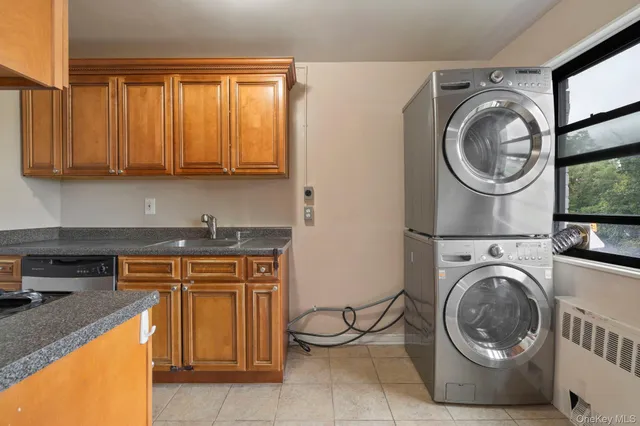 a kitchen with a stove top oven sink and cabinets