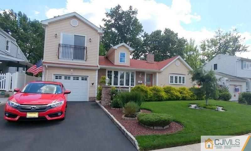 67 Westminster Road Colonia, NJ 07067 - Photo 1 of 1 a front view of a house with a yard