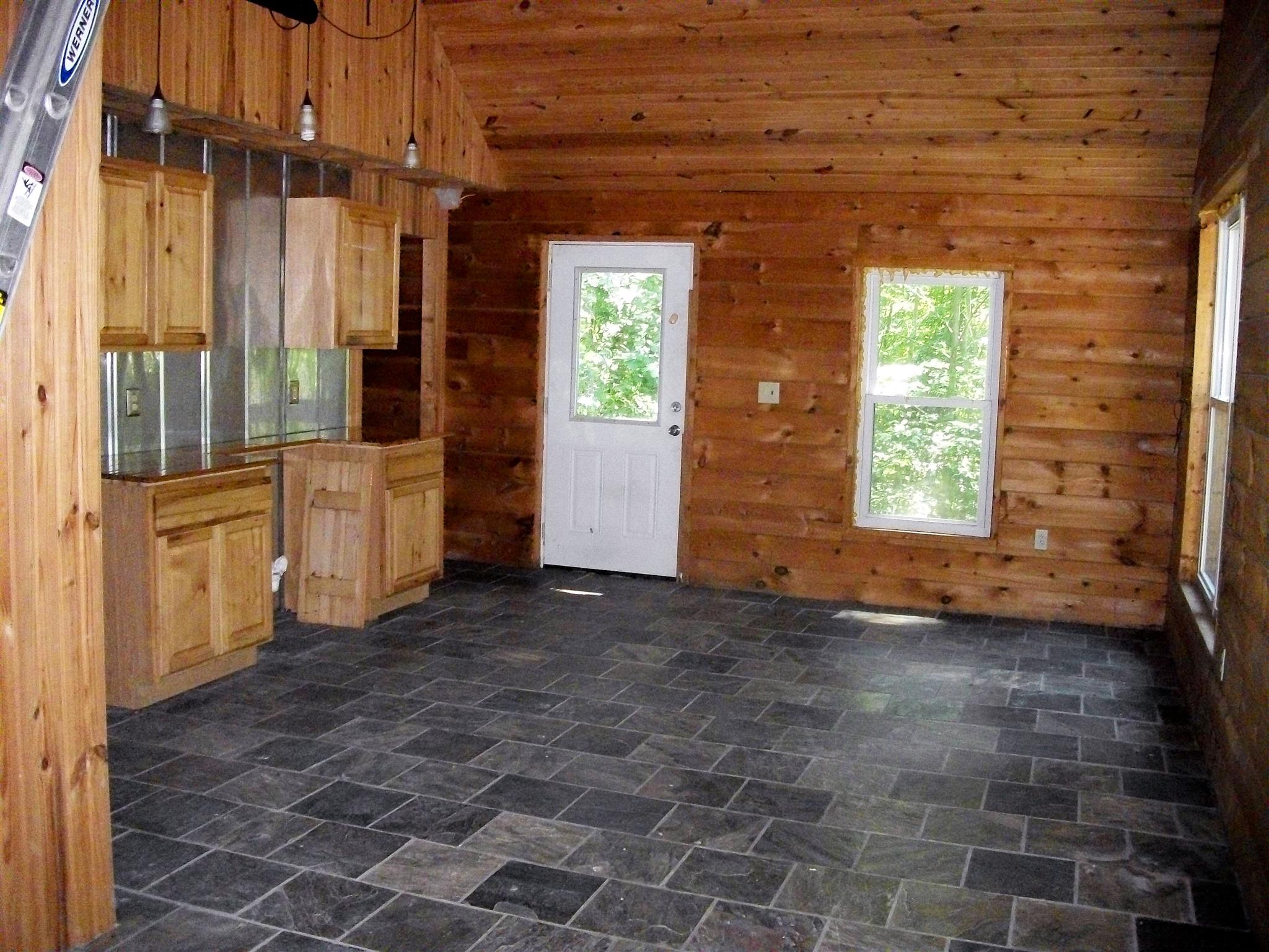 1137 Walden Ridge Road Manchester, TN 37355 - Photo 7 of 23 a view of a brick house with a large door
