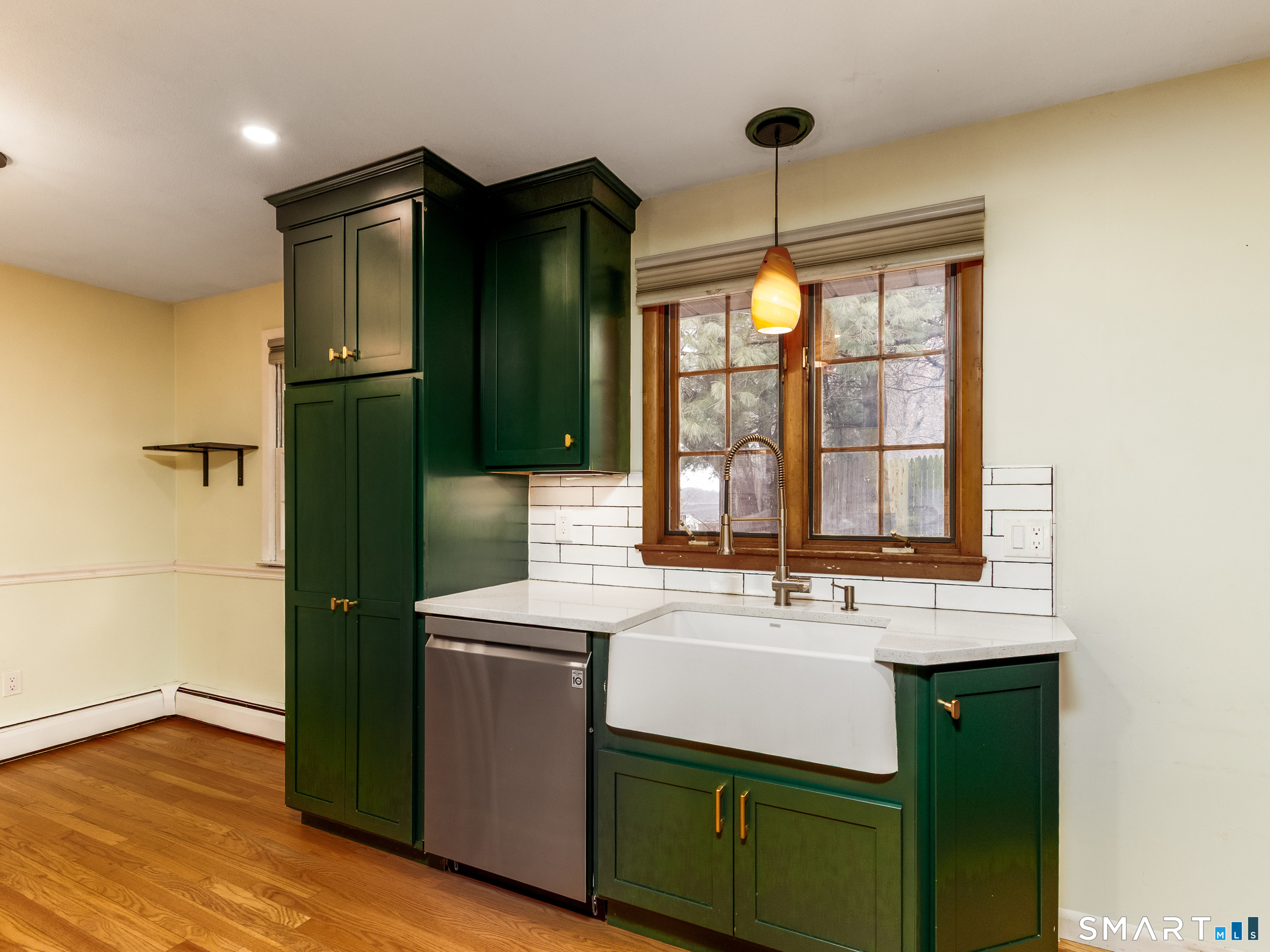 9 Empire Avenue Meriden, CT 06450 - Photo 13 of 31 a kitchen with a sink and wooden cabinets