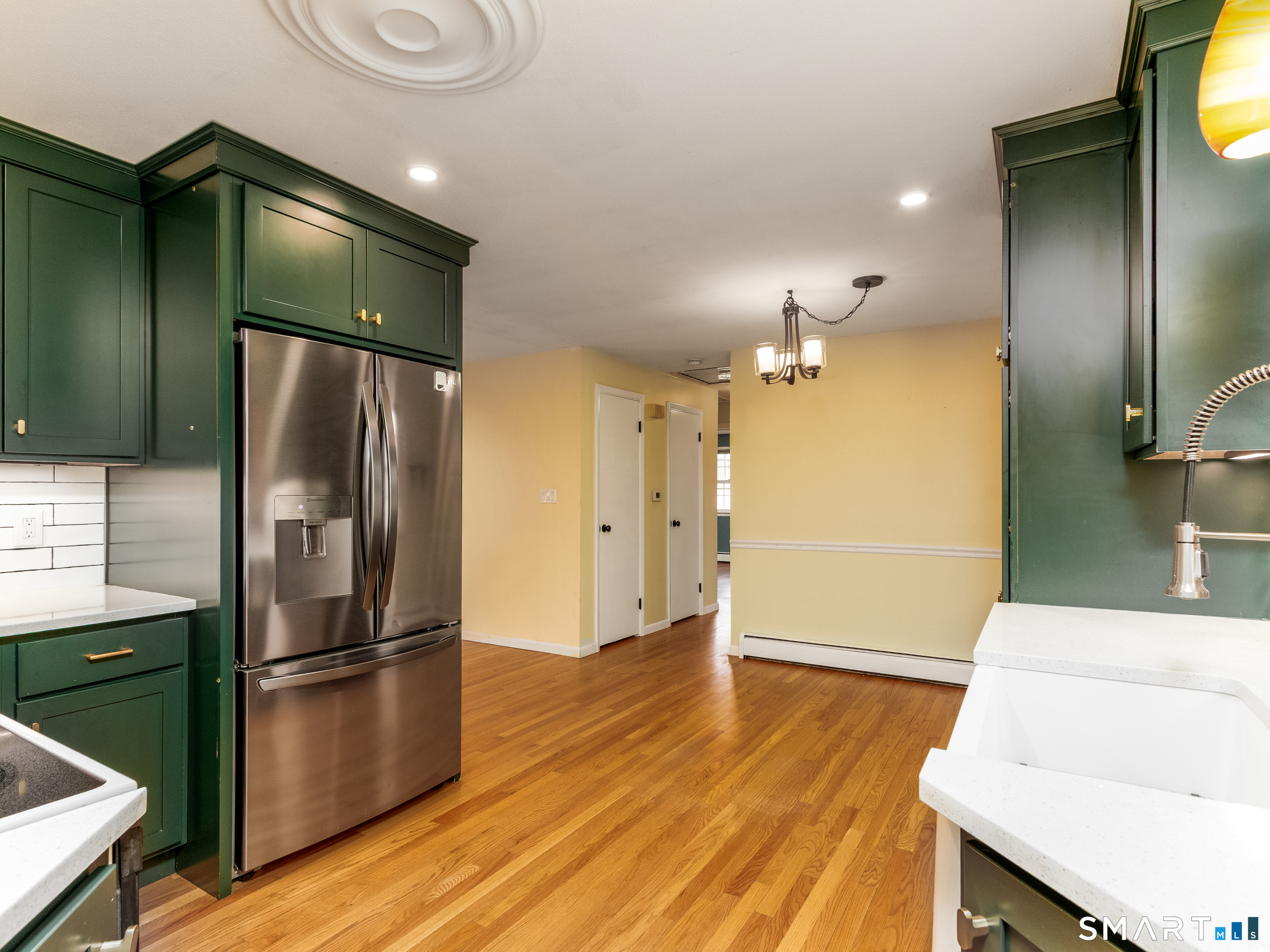 9 Empire Avenue Meriden, CT 06450 - Photo 14 of 31 a kitchen with a refrigerator and a sink