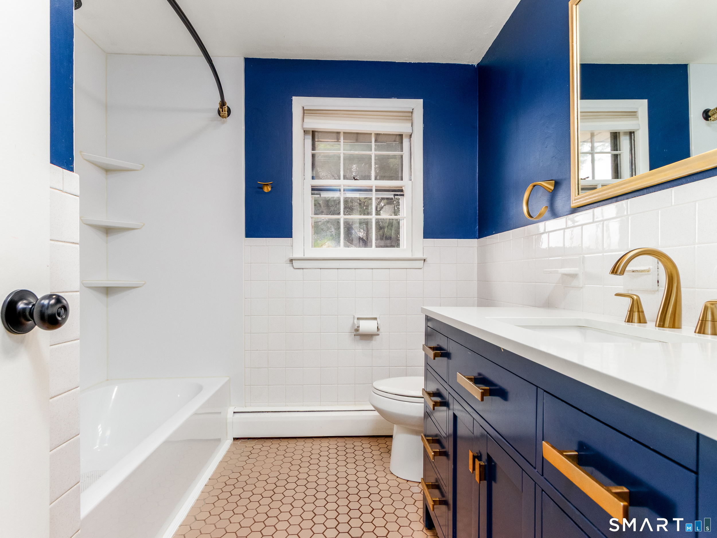9 Empire Avenue Meriden, CT 06450 - Photo 16 of 31 a bathroom with a sink a toilet and bathtub