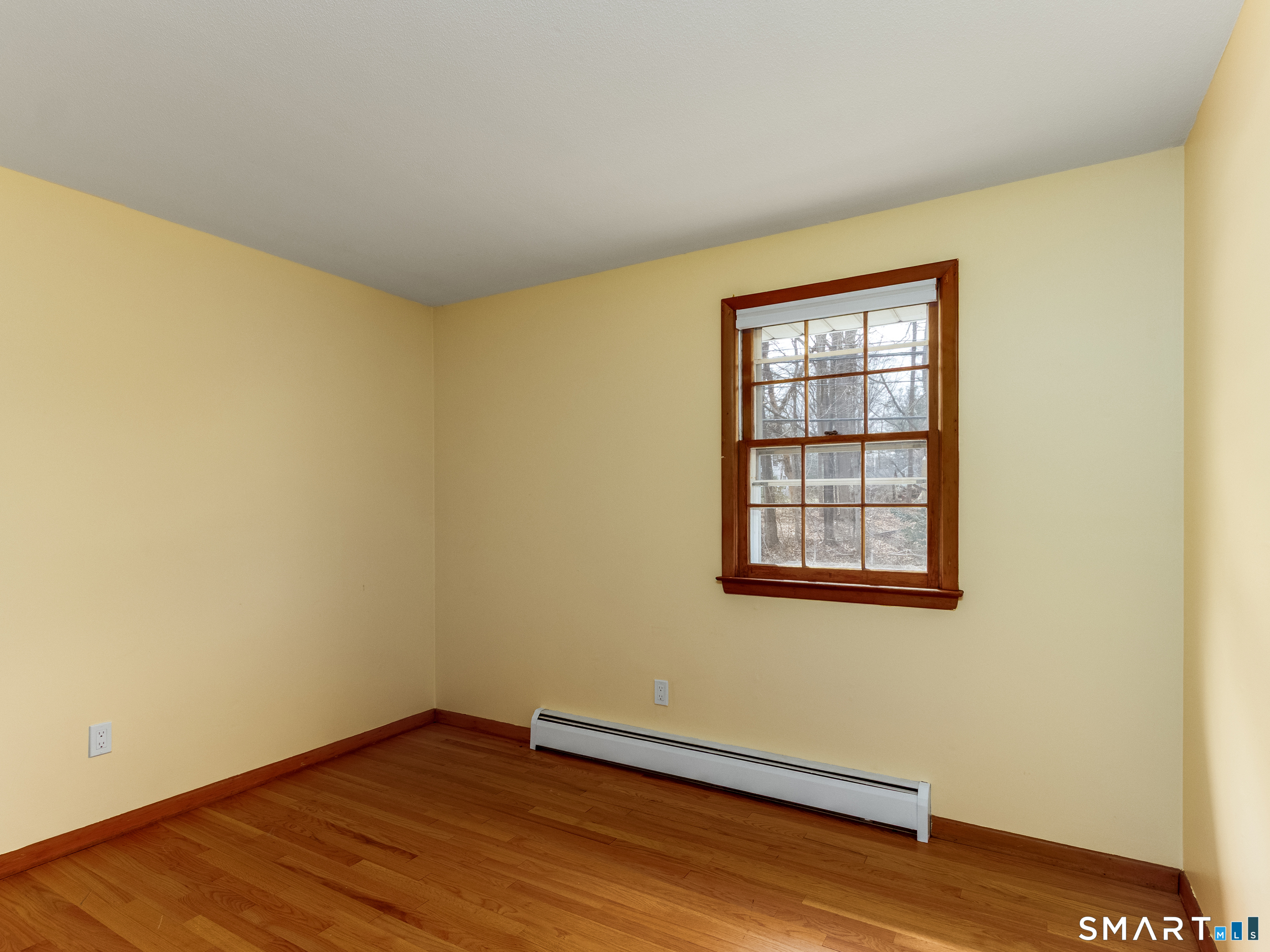 9 Empire Avenue Meriden, CT 06450 - Photo 21 of 31 an empty room with wooden floor and windows